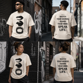 People wearing t-shirts with text and graphics on a street backdrop